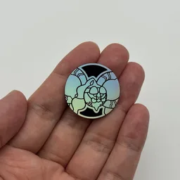 In hand, from Pokémon Coin Fan, full size