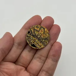 In hand, from Pokémon Coin Fan, full size