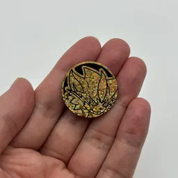 In hand, from Pokémon Coin Fan, full size