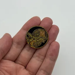 In hand, from Pokémon Coin Fan, full size