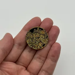 In hand, from Pokémon Coin Fan, full size