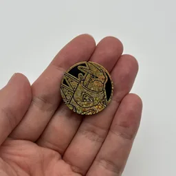 In hand, from Pokémon Coin Fan, full size