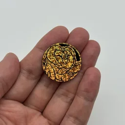 In hand, from Pokémon Coin Fan, full size