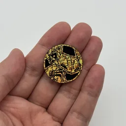 In hand, from Pokémon Coin Fan, full size