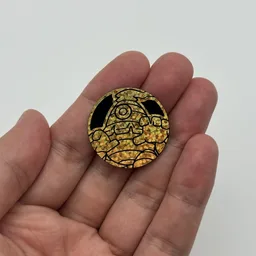 In hand, from Pokémon Coin Fan, full size