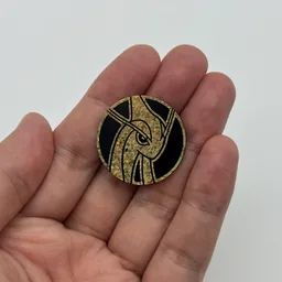 In hand, from Pokémon Coin Fan, full size