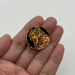 In hand, from Pokémon Coin Fan, full size