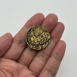 In hand, from Pokémon Coin Fan, full size