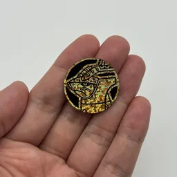 In hand, from Pokémon Coin Fan, full size