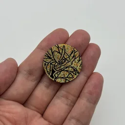 In hand, from Pokémon Coin Fan, full size