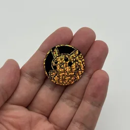In hand, from Pokémon Coin Fan, full size