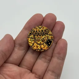 In hand, from Pokémon Coin Fan, full size
