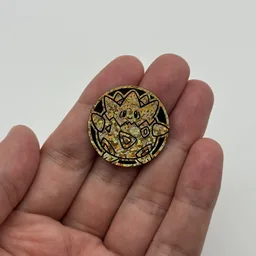 In hand, from Pokémon Coin Fan, full size