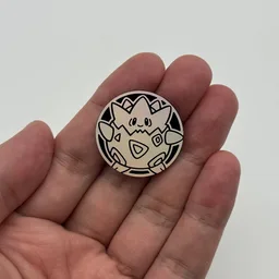 In hand, from Pokémon Coin Fan, full size