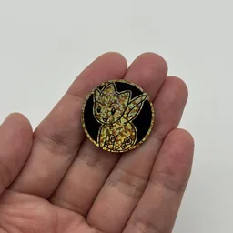 In hand, from Pokémon Coin Fan, full size