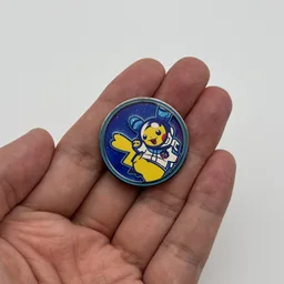 In hand, from Pokémon Coin Fan, full size