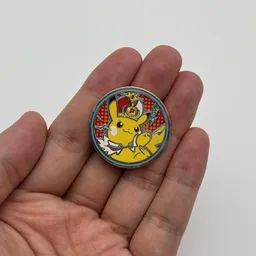 In hand, from Pokémon Coin Fan, full size